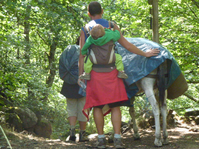 Family with over laden donkey who didn't want to go down the steep path